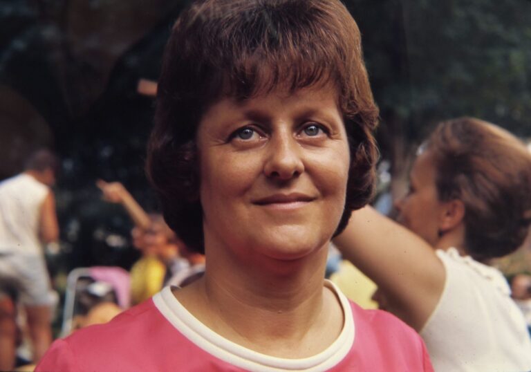 A woman in a pink top at a family picnic